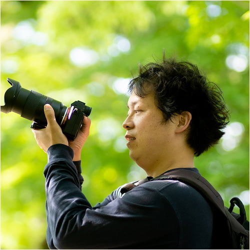 Naoki Kono, the lead photographer and founder of K.Films, smiling warmly.